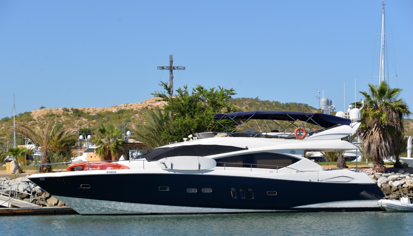 Puerto Los Cabos Marina with luxury yachts docked against a backdrop of desert mountains